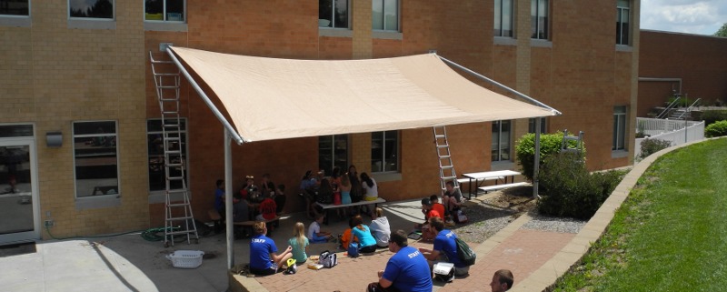 Image of custom made shade structure for YMCA patio area Lincoln, NE.