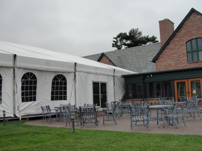 view of Omaha Tent Rental with cathedral walls and double doors at Omaha Country club