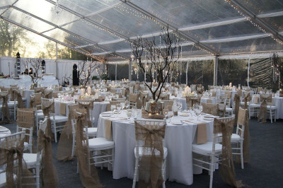 Image of tent set for a stately dinner - cear tent provides and awesome view