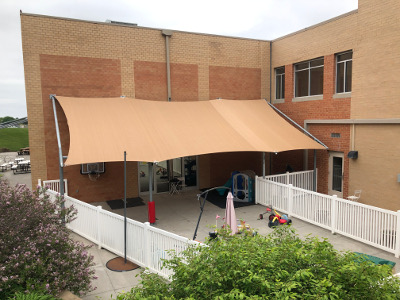 Shade cover provided for play area at YNCA.