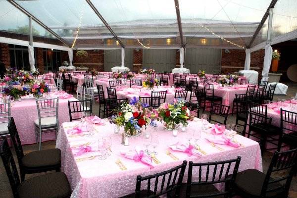 Image of tent set for a wedding reception. It is pretty and pink