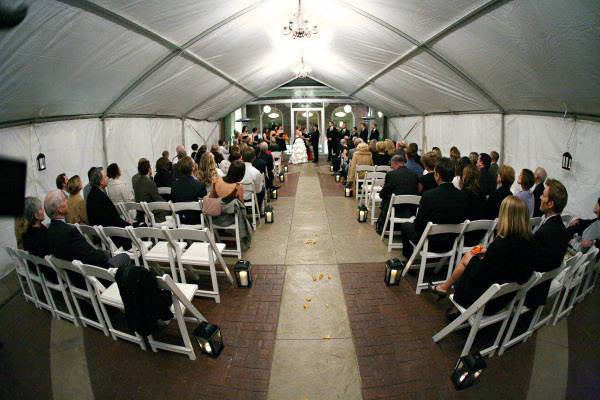Guest seated in a tent rented for a wedding ceremony in Omaha, NE 