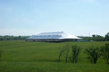 image of giant 86 X 215 white tent rental in a field