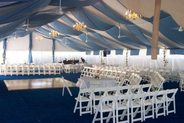 Image of clear span structure with brass chandeliers