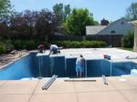View of decking over a pool to create area to set tent in backyard