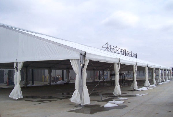 Image of a clear span tent used to create a permenant shade cover for a picnic area.