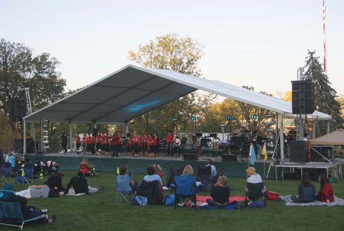Temporary outdoor stage in park for Omaha, NE summer music series
