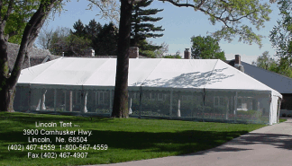 Clear span frame tent with screen walls for Omaha, NE wedding 