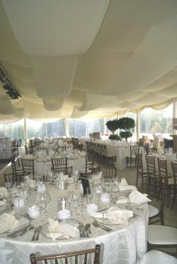 Image of liner with customer supplied festooning in wedding tent Omaha, Nebraska