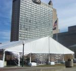 Kansas City tent rental with single stacked weights along front of tent